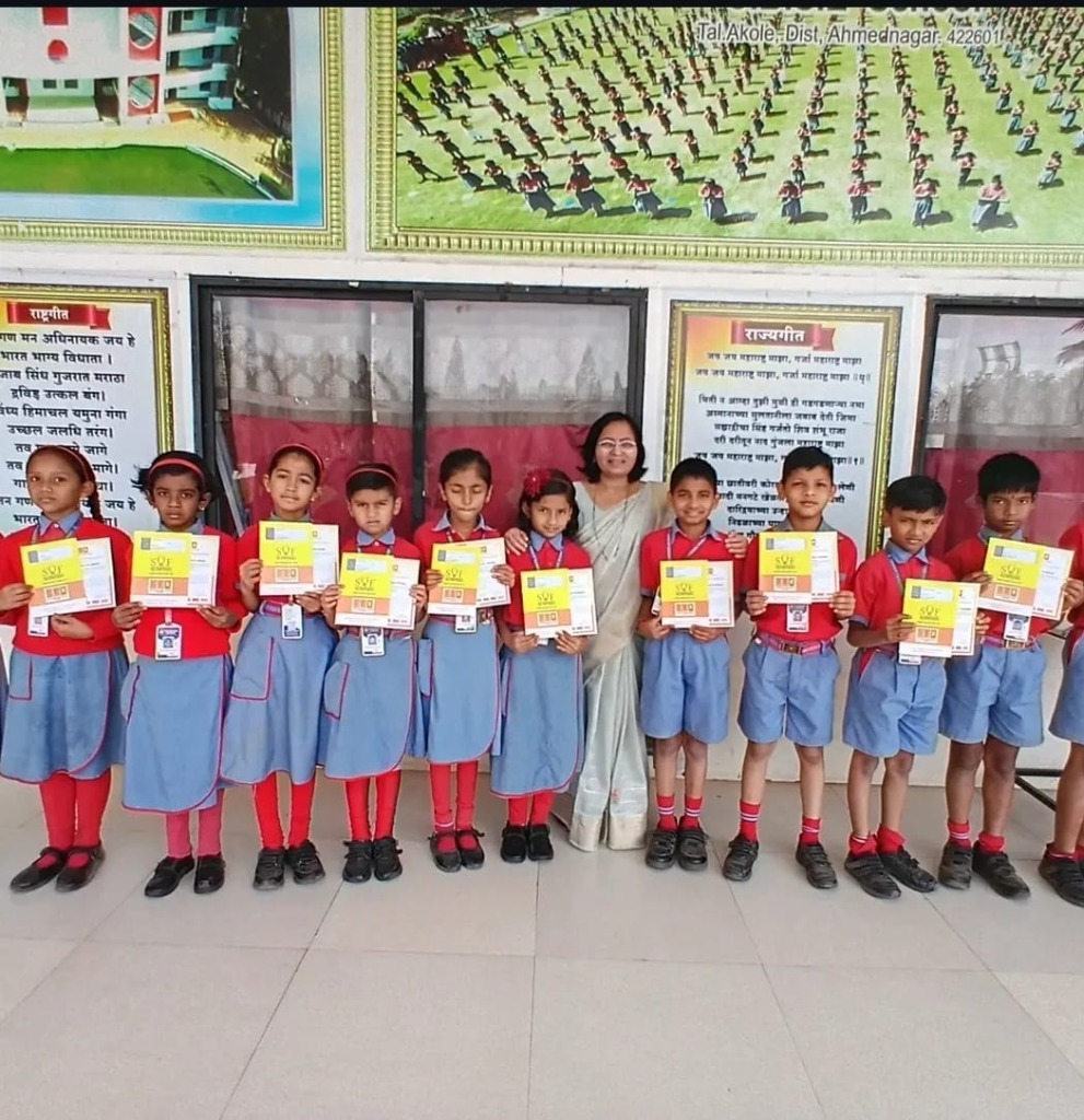 Students of Vasundhara Academy Akole with SOF Olympiad awards